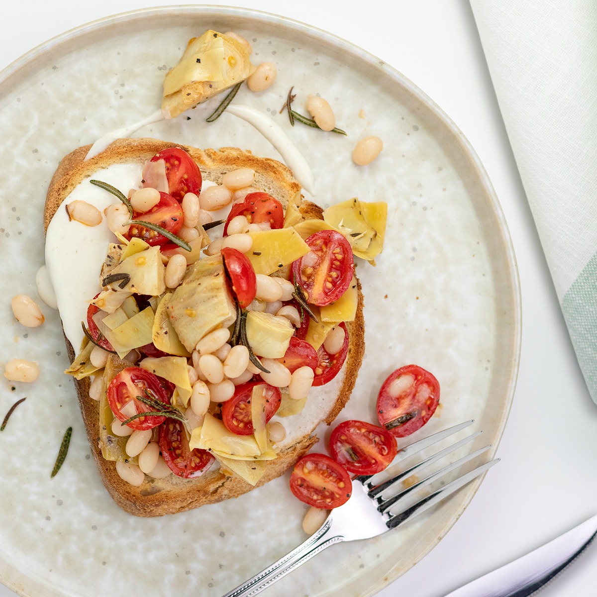 Drippy Goat Cheese Toasts with Artichokes, Tomatoes & White Beans Off